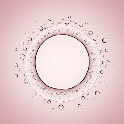 Clear liquid in circle formation on pink gradient background